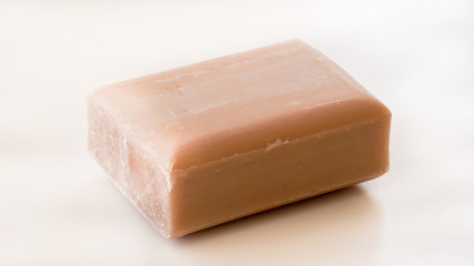 Piece of craft natural soap on white background