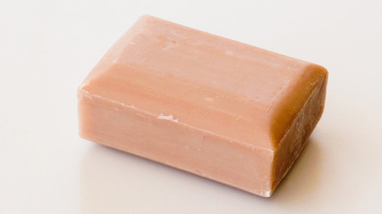 Piece of craft natural soap on white background