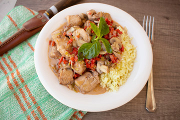 Spiced rice with chicken in mushroom and cream sauce