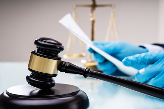 Judge Or Lawyer In Courtroom With Gavel
