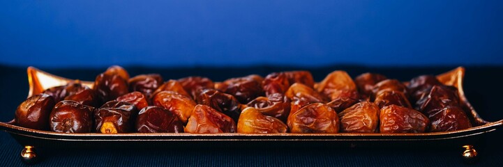 Beautiful bowl full of date fruits.