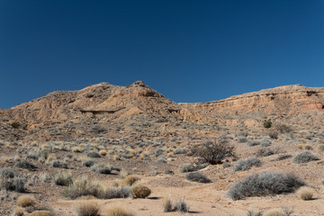 Brilliant blue sky above a mountain ridge, sage brush, New Mexico desert, horizontal aspect