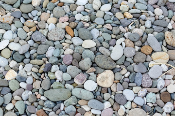 Pebble beach. the texture of stones in grey white green