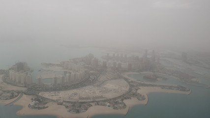 Very foggy landscape view of Doha city, photo shoot from the window inside airplane way from Bangkok to Qatar