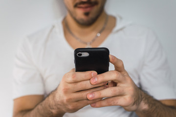young man texting on his cellphone