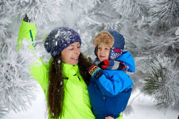 mother and son playing in snow