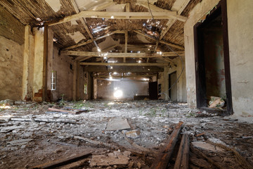 Fototapeta na wymiar Ruined and abandoned old building interior