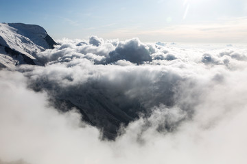 Clouds and fog over the Chamonix valley. View from the Cosmique refuge, Chamonix, France. Perfect moment in alpine highlands.