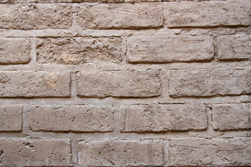 Wall made from adobe (compressed sand) background, mexican traditional construction technique