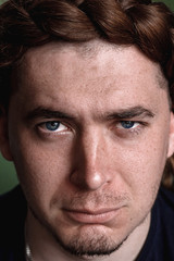 Obraz premium facial expressions. close-up . face of a man. beard and braid