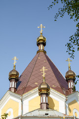 Fototapeta na wymiar Golden crosses of the Orthodox Church against the sky.