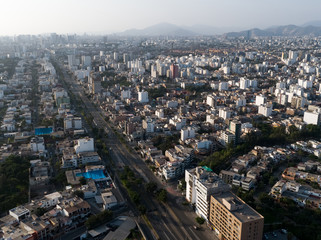 Fototapeta na wymiar Aerial drone view of Tomas Marsano avenue on Lima city at lockdown at coronavirus pandemic in 2020, in Peru.