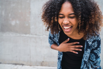 Portrait of Afro-american woman laughing.