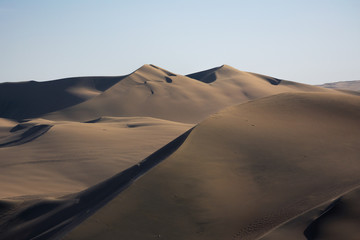 Fototapeta na wymiar Sunset in the desert dunes, in the oasis of Huacachina Peru. Two