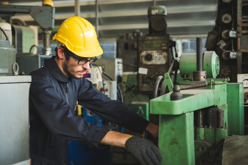 Industrial workers are working on projects in large industrial plants with many devices.