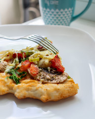 crispy hot pizza on a white plate 