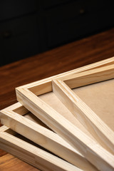 Stack of wooden frames on rustic table