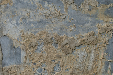 Background of a weathered wall where the plaster falls off