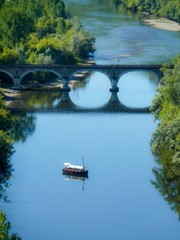 Vertical shot of a scow in Dordogne river, France at daytime