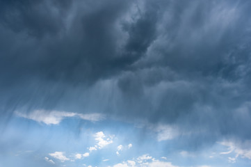 Rain during a thunderstorm and majestic clouds in sky