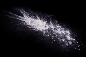 

Photos
White powder explosion on black background.Stopping the movement of white powder on dark background. Launched white powder splash