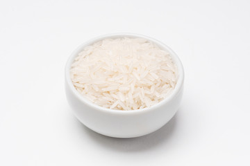 Fototapeta na wymiar Jasmine rice bowl on white background. Rice comes from seeds of grass, it is the most consumed staple food ingredient. Jasmine rice is a type of fragant long grain rice often used in chinese cuisine.