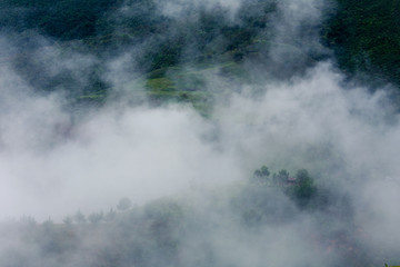 Foggy mountain in the spring morning outside the city of Medellin Colombia two