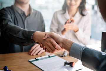 Business people shaking hands during a meeting.