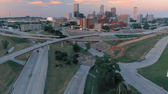 Tulsa, Oklahoma, USA. 1 May 2020.  Aerial of the Tulsa city skyline and freeway at sunset