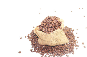 Coffee beans in a sack bag on white background