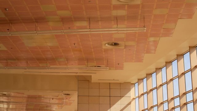 Yellow Wall ard Roof as Texture Background at Sunny Day. Window with sun lights