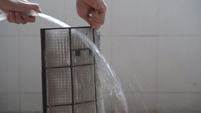 service wash or clean dirty air conditioning filter by water hose with PM 2.5 dust and disease bacteria or coronavirus to use long time and unclean at home which causes allergies and sneeze cough 4K