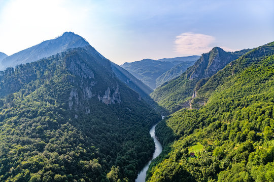 Helicopter aerial photo of the canyon of the Moraca river and the car road in Montenegro continental part.