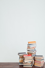 a lot of educational books for exams at the university on the white background of the library