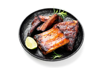 Grilled and smoked pork ribs with barbeque sauce and rosemary isolated on white background