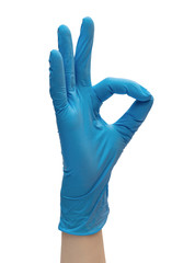 Hand in blue medical gloves showing ok sign. Isolated on white.