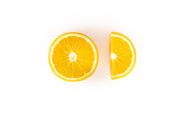 Half and a quarter sliced orange on a white background top view