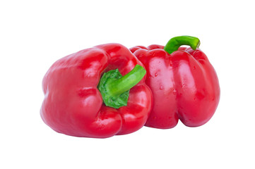 Closeup two bright red bell pepper with appetizing redness Place on a white background, take the front picture using natural light, Make the clipping path.