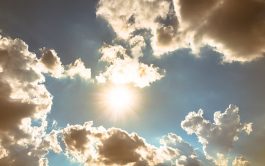 Sun light with overcast sky and brown clouds