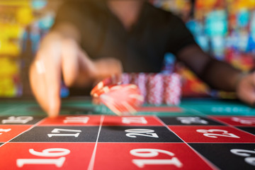 Fototapeta premium Man playing roulette at the casino