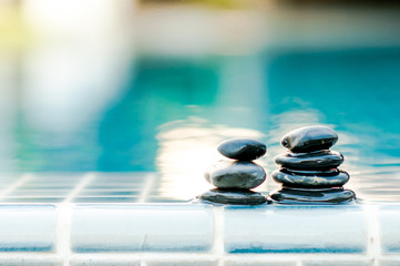 Spa still life with water lily and zen stone.