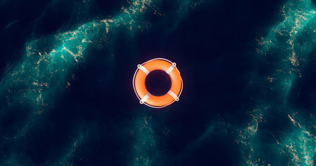 Lifebuoy floating on water. Life preserver floating in ocean. Top view of rescue ring. Life belt in...