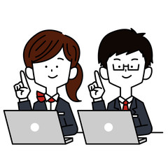 パソコンをしながら指差しする接客業の男女