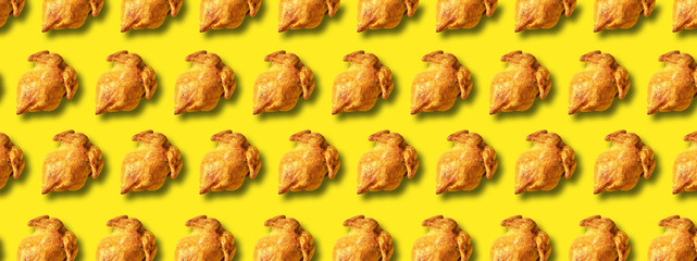 Colorful pattern of roasted chicken or turkey on yellow background. Top view. Creative design for...