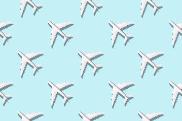 Summer pattern. Creative banner of white planes on blue background. Travel, vacation concept. Travel, vacation ban. Flights cancelled and resumed again. Top view. Flat lay. Minimal style design.