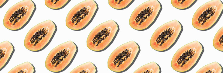 Seamless pattern with papaya. Tropical abstract background. Top view. Creative design, minimal flat lay concept. Summer time. Tropical travel, exotic papaya fruit. Vegan and vegetarian food