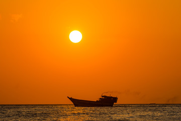 This was taken in the islands of Zanzibar at sun set. The sun was setting on the mainland side of Tanzania