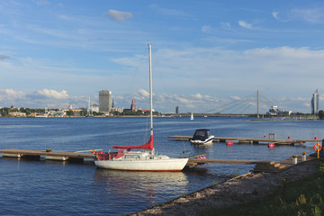 Riga, Latvia, view over the river Daugava to the city and cable-stayed bridge, yacht parking lot in the foreground
