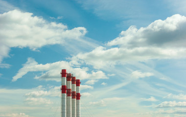 Industrial pipes against blue sky