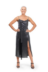 Full length portrait of smiling middle-aged woman in cocktail dress with hands on waist